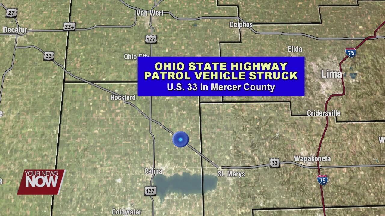 State highway patrol car hit while sitting on the side of US 33